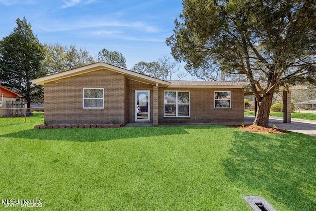 ranch-style house featuring brick siding, a front lawn, and fence