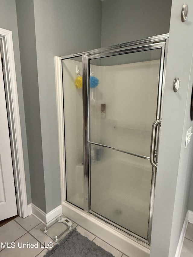9958 Kahana St, Diamondhead, MS 39525 - full bath featuring tile patterned floors and a stall shower