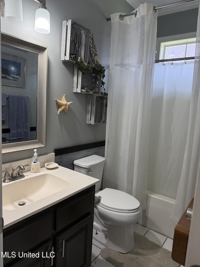 9958 Kahana St, Diamondhead, MS 39525 - full bathroom featuring vanity, tile patterned flooring, shower / bath combination with curtain, and tile walls
