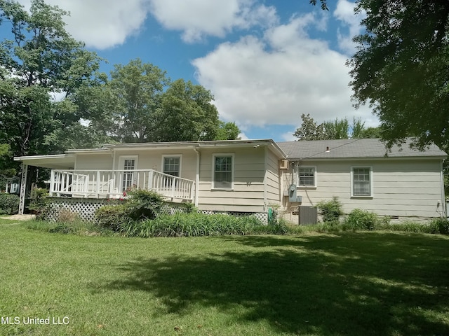 207 W Percy St, Indianola, MS 38751 - back of property featuring a yard and a wooden deck