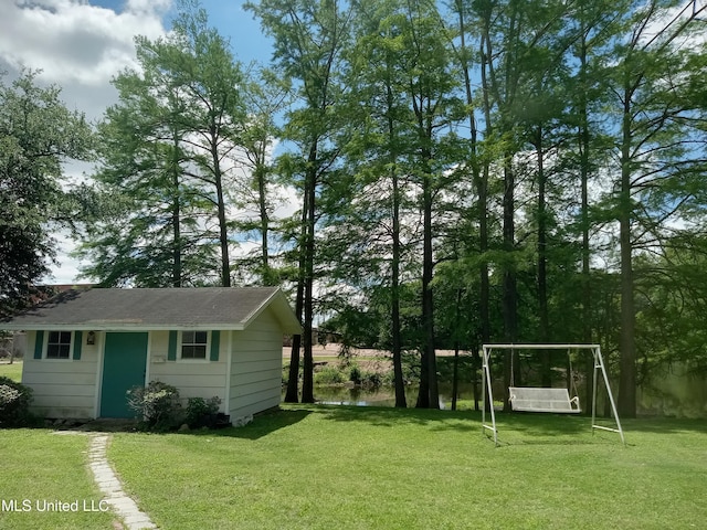 207 W Percy St, Indianola, MS 38751 - view of grassy yard with an outbuilding