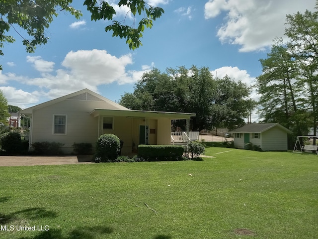 207 W Percy St, Indianola, MS 38751 - back of house featuring a yard