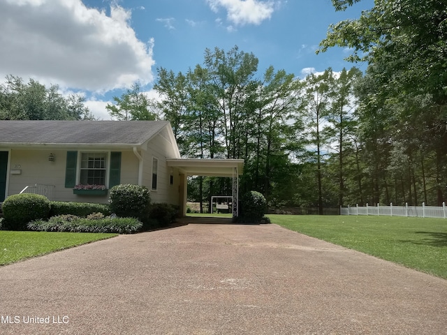 207 W Percy St, Indianola, MS 38751 - view of side of home with concrete driveway and a shingled roof