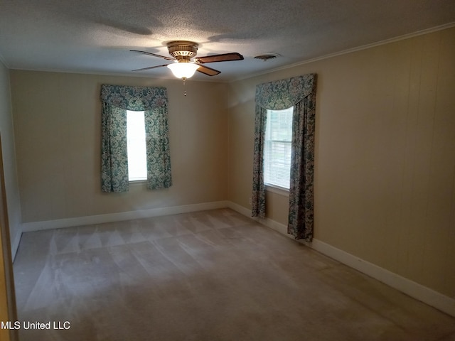 207 W Percy St, Indianola, MS 38751 - spare room featuring light carpet, a ceiling fan, a textured ceiling, and baseboards