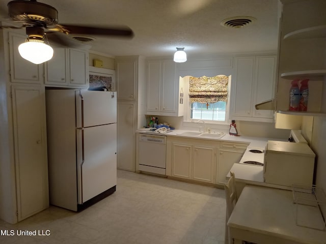 207 W Percy St, Indianola, MS 38751 - kitchen with white appliances, open shelves, a sink, a ceiling fan, and light countertops