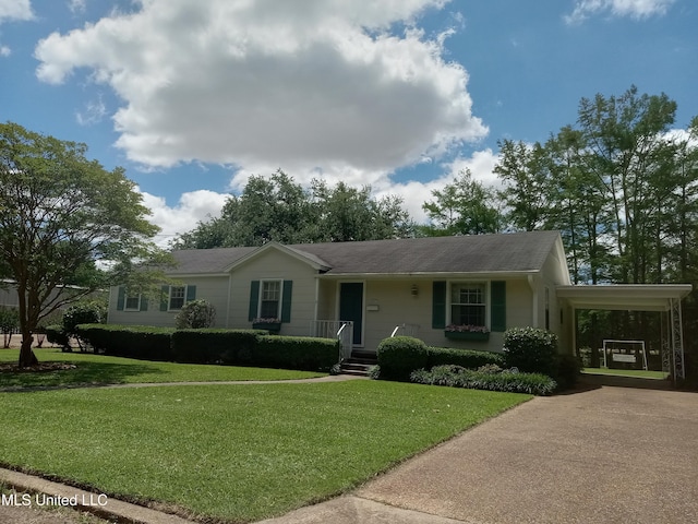 207 W Percy St, Indianola, MS 38751 - single story home featuring concrete driveway, a carport, and a front lawn