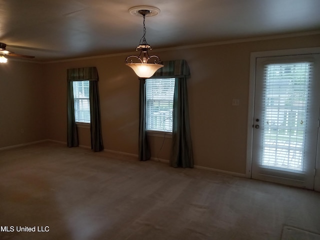 207 W Percy St, Indianola, MS 38751 - unfurnished room featuring healthy amount of natural light, ornamental molding, a ceiling fan, light carpet, and baseboards