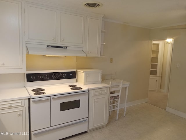 207 W Percy St, Indianola, MS 38751 - kitchen featuring white range with electric cooktop, under cabinet range hood, white cabinets, light countertops, and ornamental molding