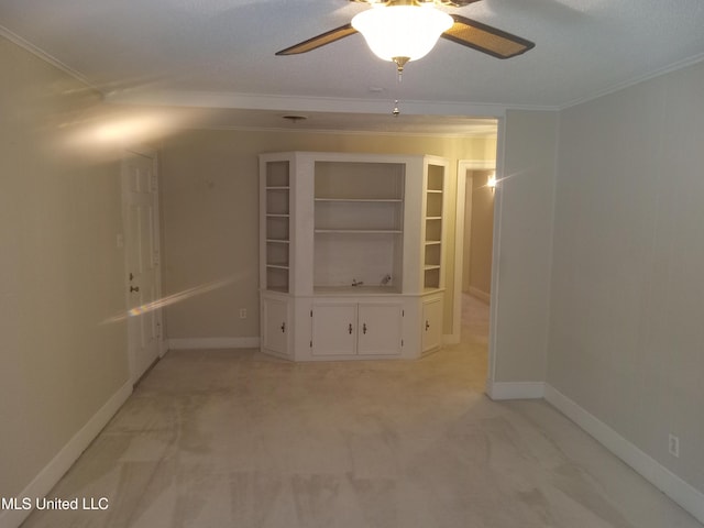 207 W Percy St, Indianola, MS 38751 - empty room with a ceiling fan, crown molding, light carpet, and baseboards