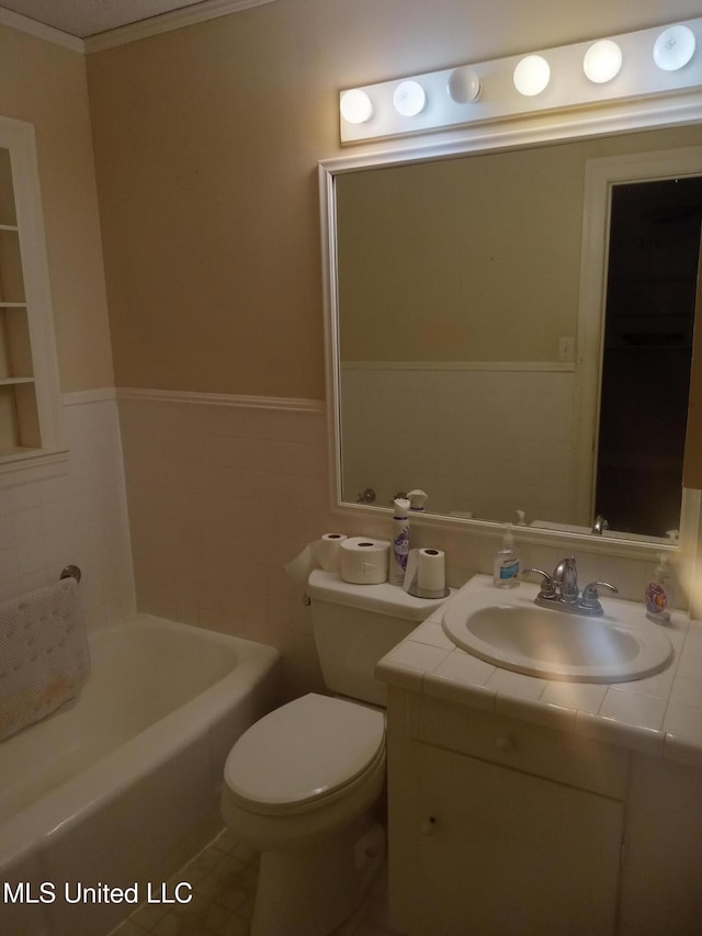 207 W Percy St, Indianola, MS 38751 - full bathroom with a wainscoted wall, toilet, a tub to relax in, vanity, and crown molding