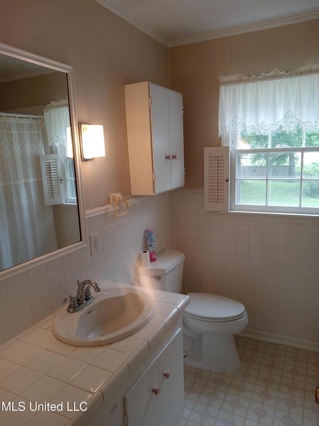 207 W Percy St, Indianola, MS 38751 - full bath featuring tile walls, ornamental molding, toilet, vanity, and a shower with shower curtain