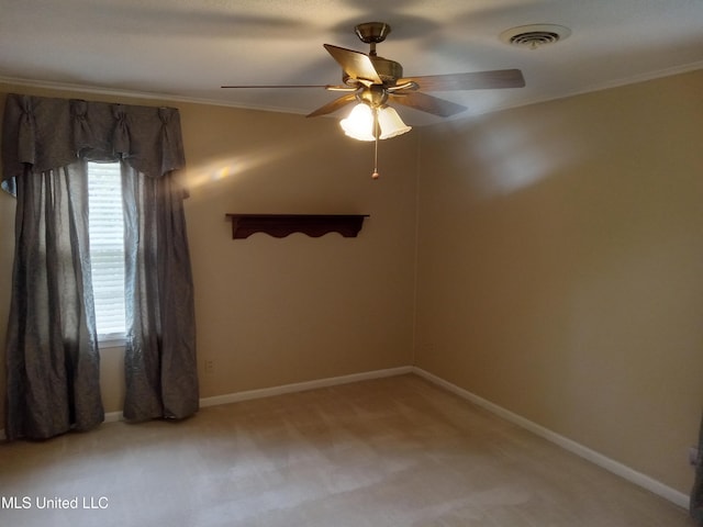 207 W Percy St, Indianola, MS 38751 - spare room featuring light carpet, a ceiling fan, crown molding, and baseboards