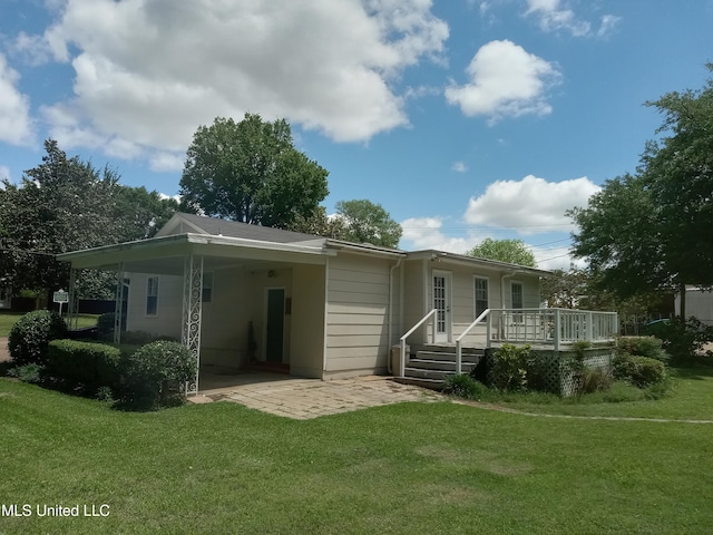 207 W Percy St, Indianola, MS 38751 - rear view of house featuring a yard and a deck