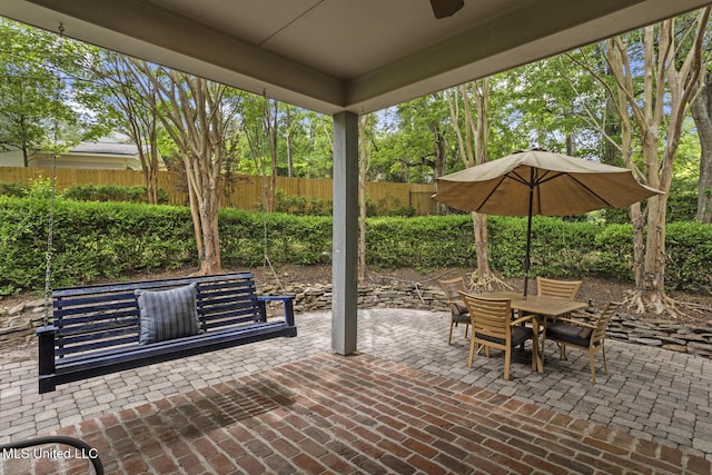 435 Glenway Dr, Jackson, MS 39216 - view of patio with fence, a ceiling fan, and outdoor dining space