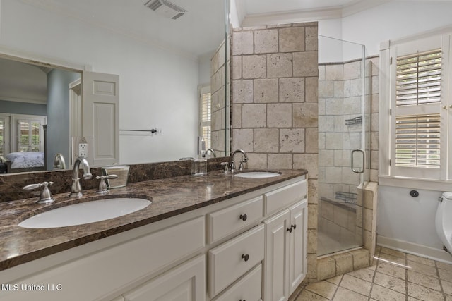 435 Glenway Dr, Jackson, MS 39216 - ensuite bathroom featuring a shower stall, visible vents, ornamental molding, and a sink