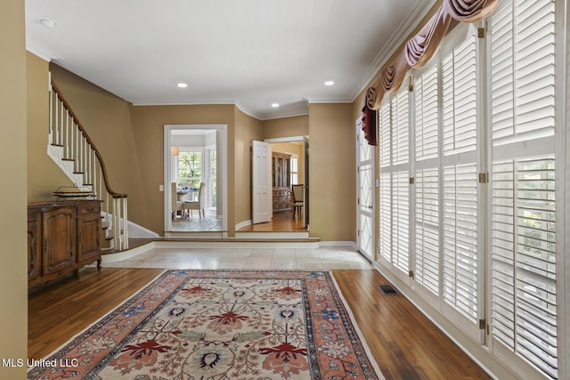 435 Glenway Dr, Jackson, MS 39216 - foyer with baseboards, crown molding, wood finished floors, and stairway
