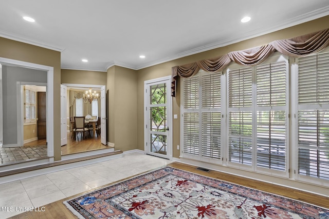 435 Glenway Dr, Jackson, MS 39216 - tiled entrance foyer with visible vents, baseboards, an inviting chandelier, ornamental molding, and recessed lighting
