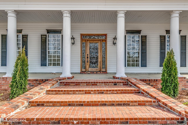 entrance to property with a porch