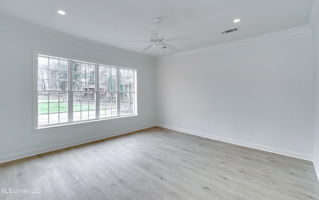 unfurnished room featuring ornamental molding, ceiling fan, light hardwood / wood-style flooring, and a wealth of natural light