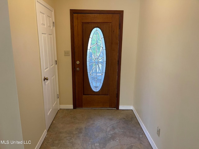 foyer entrance featuring concrete flooring