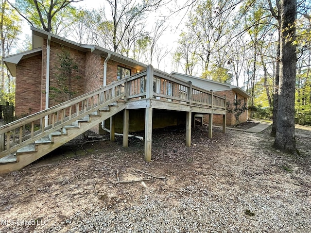 back of property featuring a deck