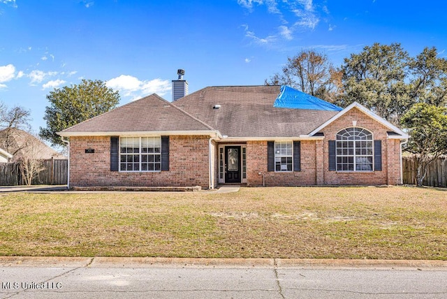 ranch-style house with a front lawn