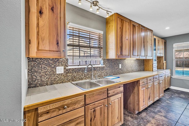 kitchen with sink and decorative backsplash