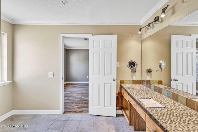 bathroom featuring crown molding and tile patterned floors