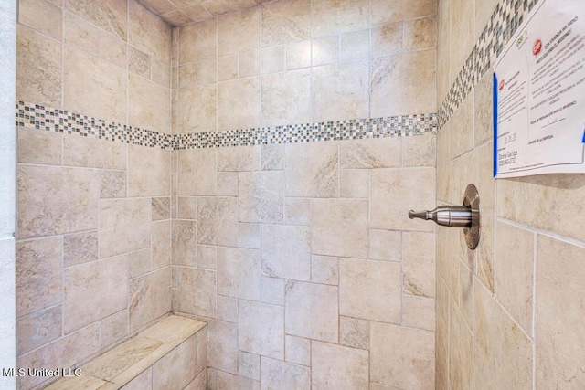 bathroom featuring tiled shower