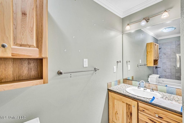 bathroom with vanity, ornamental molding, and toilet