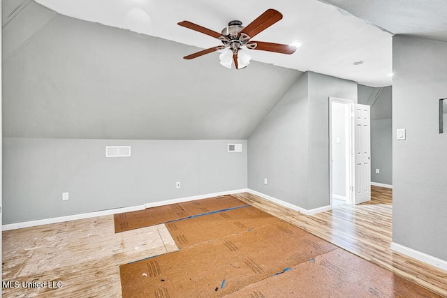 bonus room with ceiling fan, vaulted ceiling, and wood-type flooring