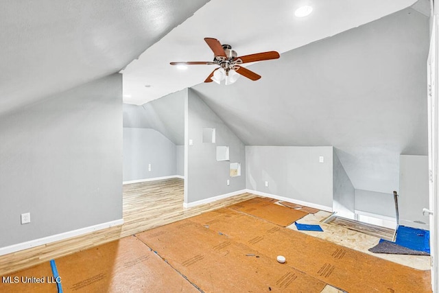 bonus room with ceiling fan, lofted ceiling, and hardwood / wood-style floors