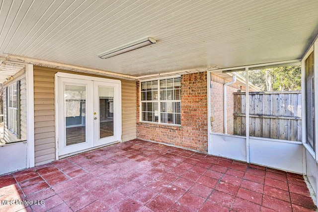 unfurnished sunroom featuring french doors