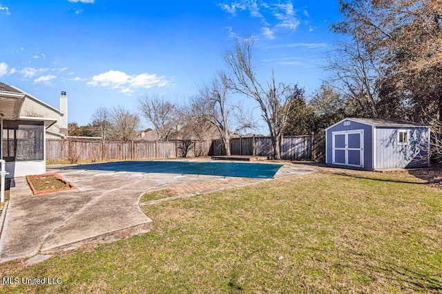 view of pool featuring a patio area, a shed, and a lawn