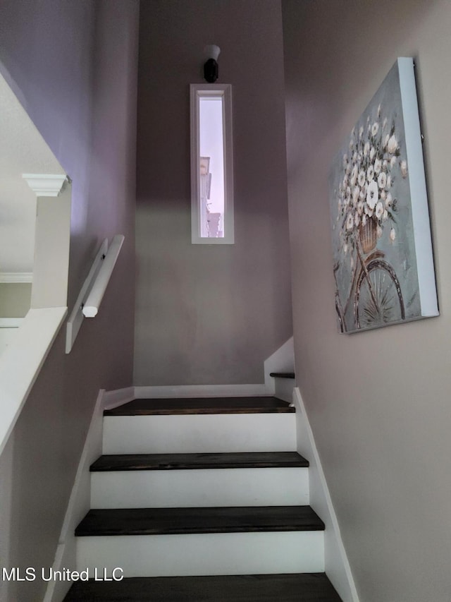 stairway with baseboards