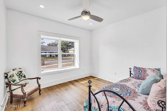 bedroom with wood-type flooring and ceiling fan