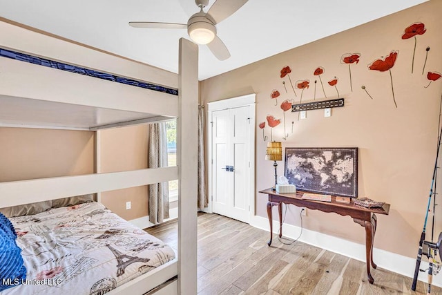 bedroom with ceiling fan and light hardwood / wood-style flooring