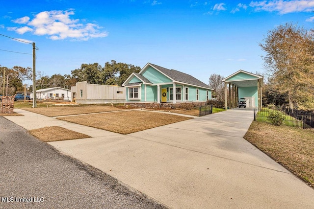 ranch-style home with a carport and a front lawn