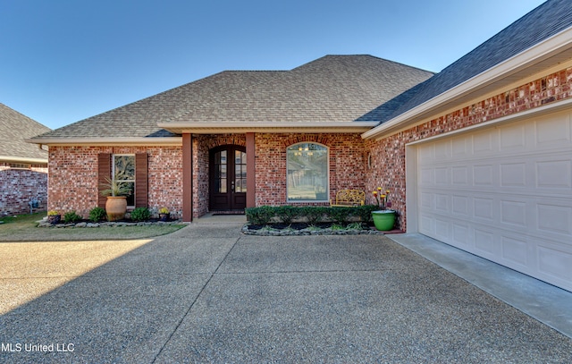 view of front facade with french doors and a garage