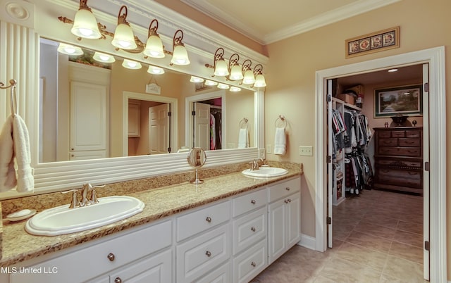 bathroom with tile patterned flooring, vanity, and crown molding