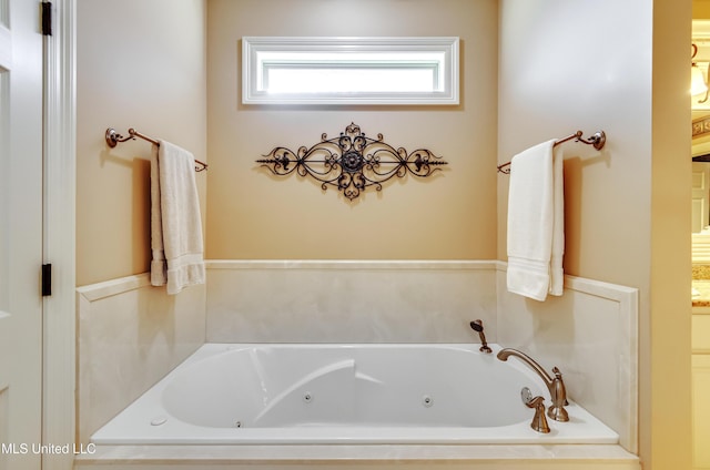 bathroom with a tub to relax in