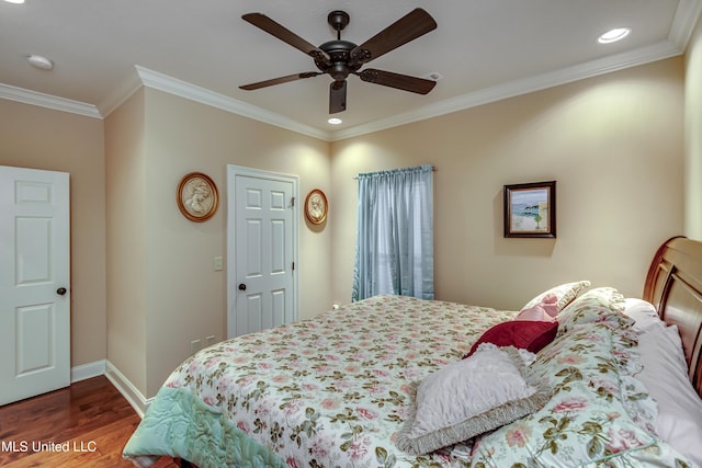 bedroom featuring hardwood / wood-style floors, ceiling fan, and crown molding