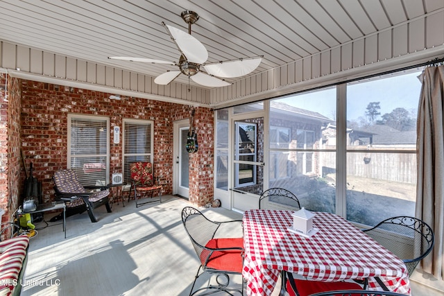 sunroom with plenty of natural light and ceiling fan