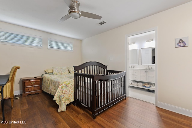 7829 Alawai Ave, Diamondhead, MS 39525 - bedroom with visible vents, baseboards, ensuite bathroom, and wood finished floors