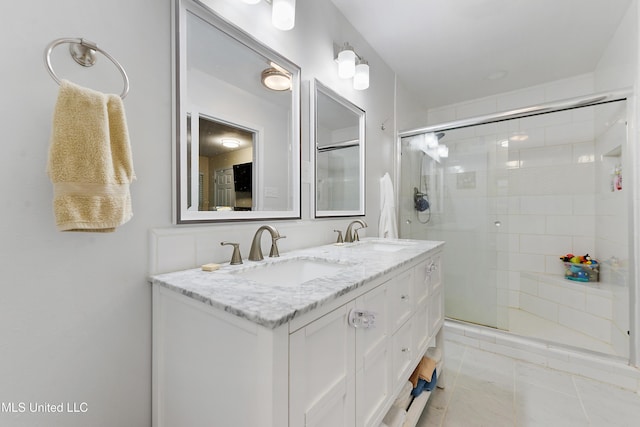 7829 Alawai Ave, Diamondhead, MS 39525 - full bath featuring a shower stall, tile patterned floors, double vanity, and a sink