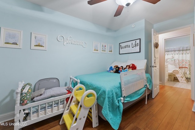 7829 Alawai Ave, Diamondhead, MS 39525 - bedroom featuring a ceiling fan and wood finished floors