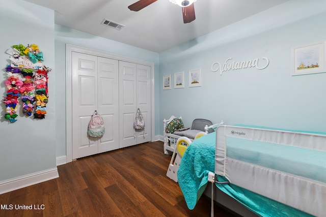 7829 Alawai Ave, Diamondhead, MS 39525 - bedroom featuring visible vents, baseboards, a closet, ceiling fan, and wood finished floors