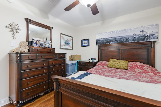 7829 Alawai Ave, Diamondhead, MS 39525 - bedroom featuring a ceiling fan and wood finished floors