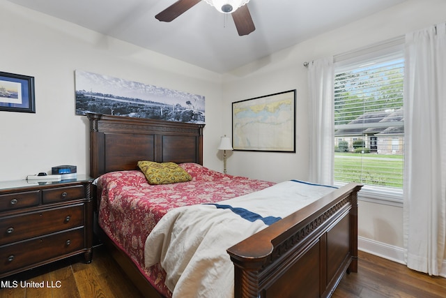 7829 Alawai Ave, Diamondhead, MS 39525 - bedroom with baseboards, a ceiling fan, and dark wood finished floors