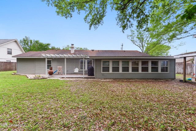 7829 Alawai Ave, Diamondhead, MS 39525 - rear view of property with a pergola, a yard, a patio area, and fence